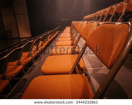 Small theater hall with folding chairs