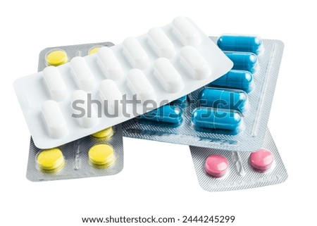 Various medicine capsules, pills and tablets in a blister pack isolated on white background, healthcare and medicine concept. Royalty-Free Stock Photo #2444245299