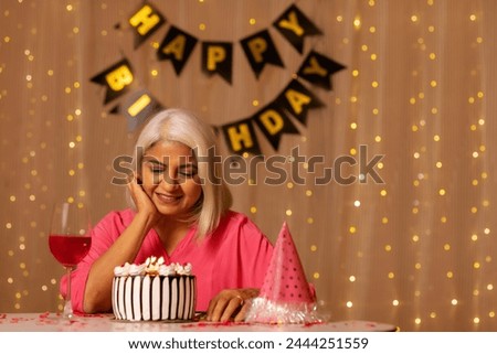 Old lady lonely celebrating her birthday at home