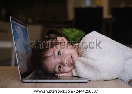 Kid baby student using laptop for searching, working, online learning, marketing, freelance, studying, distance education network online technology background.	