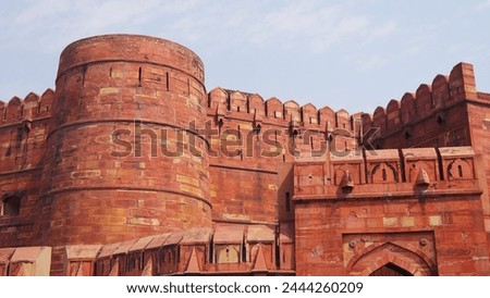 Red Fort, important Mughal monument and Hindu architectural style, historical and artistic beauty, with its red and warm colored bricks and stones, Indian cultural visit, with its symmetrical shapes  Royalty-Free Stock Photo #2444260209