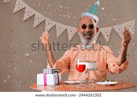 Senior man celebrating his birthday at home