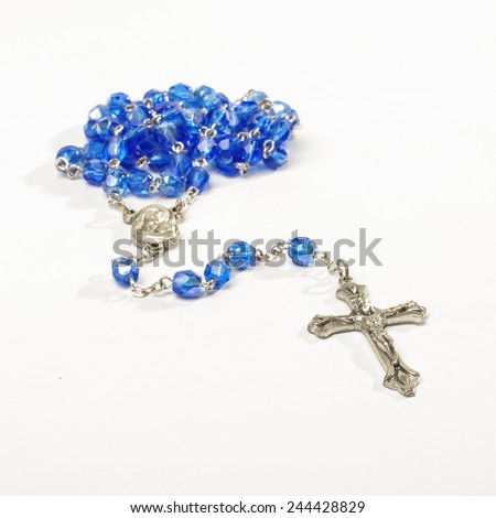 Blue rosary isolated on the white background