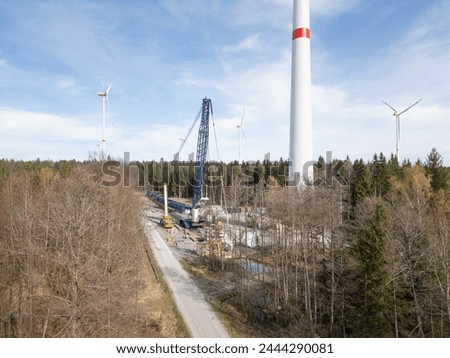 Construction site and erection of a wind turbine in the forest Royalty-Free Stock Photo #2444290081