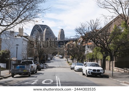 Empty Sydney suburban street with the Harbour Bridge in the background Royalty-Free Stock Photo #2444303535