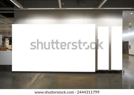 Mockup different sizes of three blank billboards with lighting near the wall and corridor in building, Empty space to insert your advertisement 