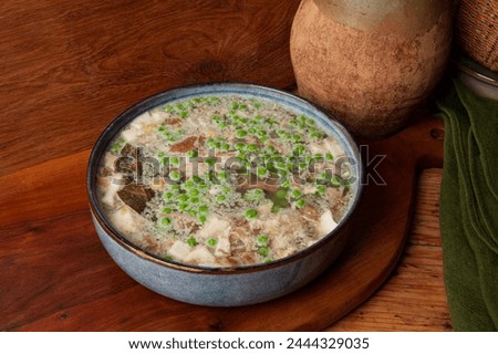 Jellied veal is a cold cut dish made from veal, pork, stock, onion and spices such as allspice, bay leaf and  pepper. Sometimes we add carrots and green peas. A popular dish in Europe