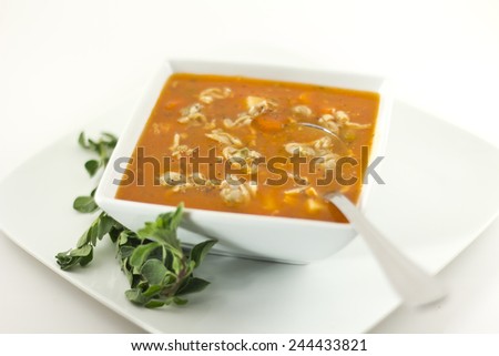 Hearty Manhattan Clam Chowder soup with fresh oregano