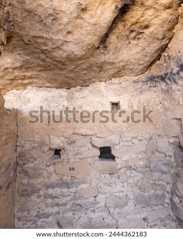 Balcony House at Mesa Verde National Park in Colorado. Kiva Plaza, original design was painted on a wall: a band with three triangles above. Protects Ancestral Puebloan site, famous cliff dwelling.  Royalty-Free Stock Photo #2444362183