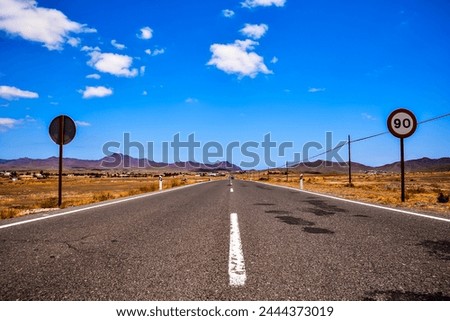 Photo Picture of a Beautiful Asphalt Lonely Road Royalty-Free Stock Photo #2444373019