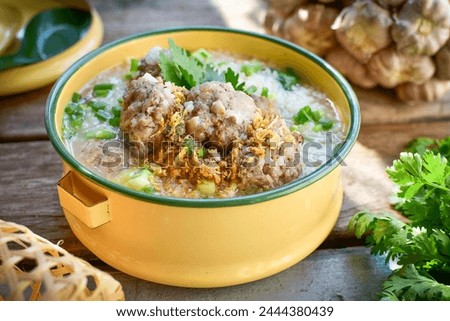 Rice porridge with minced pork on tiffin thai called pinto