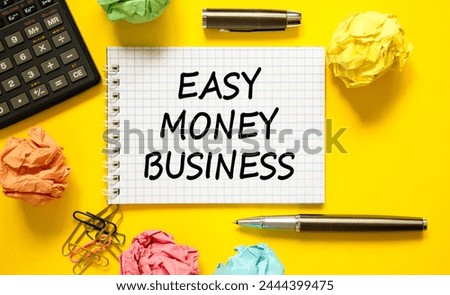 Easy money business symbol. Concept words Easy money business on beautiful white note. Beautiful yellow background. Black pen. Colored paper. Calculator. Easy money business concept. Copy space.