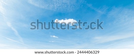 Blue sky with a small white cloud in springtime