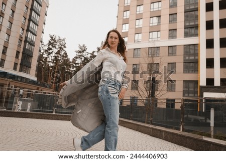 a girl walks around the city, street style photo session