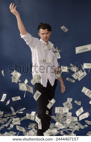 a man in a white shirt throws money left and right, money rains