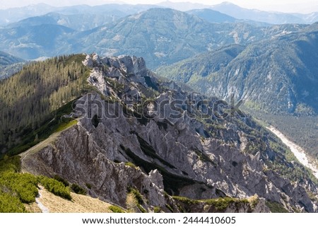 Panoramic view of unique rock formation in Hochschwab mountain range, Styria, Austria, Scenic hiking trail from Karlhochkogel via Kaefereck to Sankt Ilgen. Escapism in remote Austrian Alps. Wanderlust Royalty-Free Stock Photo #2444410605