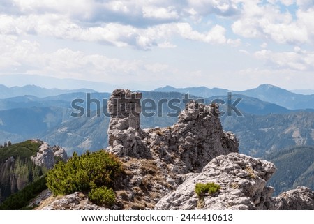 Panoramic view of unique rock formation in Hochschwab mountain range, Styria, Austria, Scenic hiking trail from Karlhochkogel via Kaefereck to Sankt Ilgen. Escapism in remote Austrian Alps. Wanderlust Royalty-Free Stock Photo #2444410613