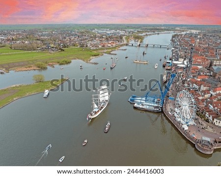 Aerial from the event sail Kampen on the river IJssel at Kampen march 2024 at sunset Royalty-Free Stock Photo #2444416003