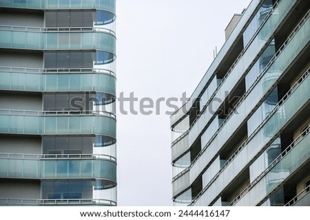 Rounded corner balconies on two apartment buildings.