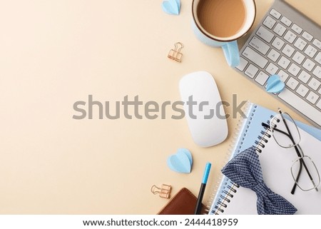 Stylized dad's workspace: top-down view of keyboard, mouse, glasses, blue heart shapes, notebook with bow tie, and cup of coffee on a beige background with space for greetings
