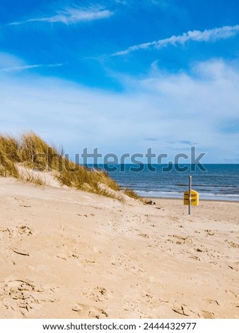 A life bouy and dune grass at Curracloe Beach, Co. Wexford, Ireland Royalty-Free Stock Photo #2444432977