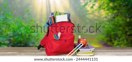 Blue School Backpack on background. Royalty-Free Stock Photo #2444441131
