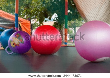 Picture of balls on a jumping jack at a patron saint festival in Peru.