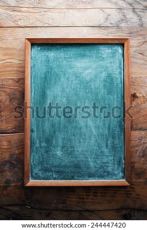 Chalkboard on wooden background