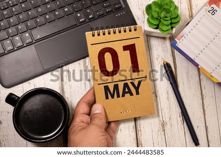 May 1st. Image of may 1 wooden color calendar on white background. Spring day, empty space for text. International Workers' Day Royalty-Free Stock Photo #2444483585