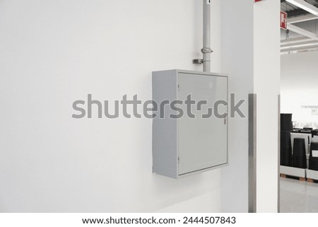 Indoors circuit breaker panel, breaker box, control electric or distribution board in office building, home or shopping mall,  copy space Royalty-Free Stock Photo #2444507843