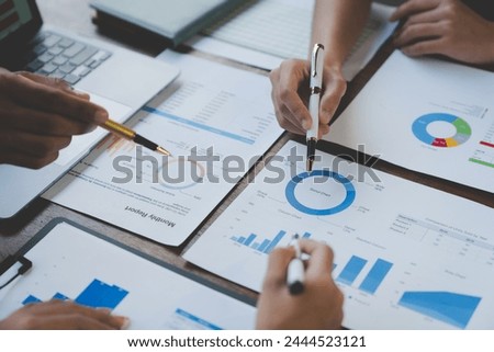 Team of business people analyzing, discussing, calculating earnings from earnings charts and graphs Growth with laptop computers and brainstorming strategies for new projects. startup business ideas