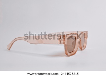 Stylish vintage sunglasses on white background