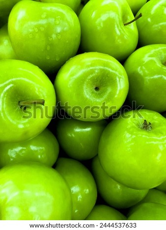 A picture of many green apples. Background of apples. High quality photo