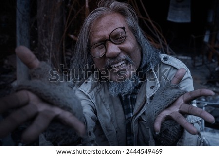 Old man showed signs of madness like a madman. When he saw his house destroyed by fire, homeless old man in front of a building destroyed by fire Royalty-Free Stock Photo #2444549469