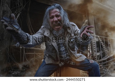 Old man showed signs of madness like a madman when he saw his house destroyed by fire Royalty-Free Stock Photo #2444550271