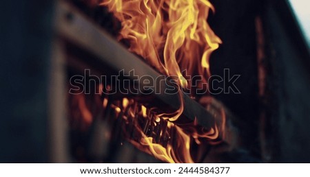 Fires on the piano, a piano burning with a bright flame. Piano on fire, slow motion. Fire from the piano. Artistic concept of the scene.