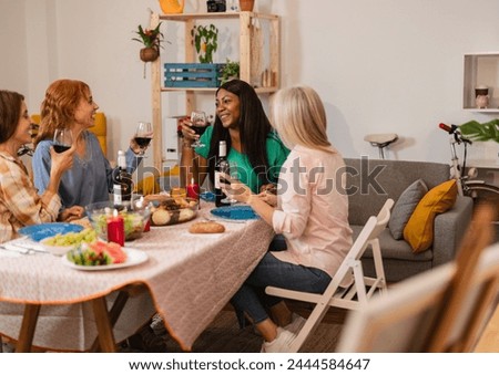 Friends Enjoying a Cozy Dinner Party at Home