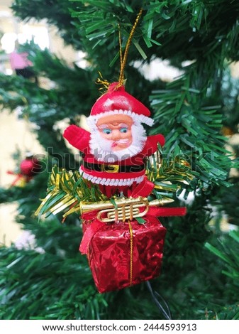 Santa Claus cartoon hang on Christmas tree 