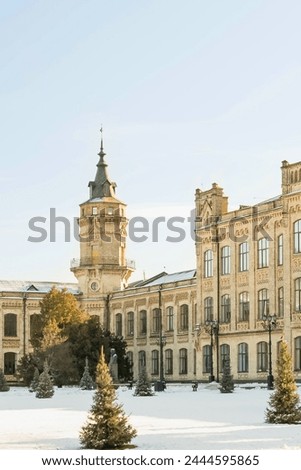 Its the photo of main building of National Technical University of Ukraine. It's view of the Igor Sikorsky Kyiv Polytechnic Institute. It is winter sunny day with  sunny sky