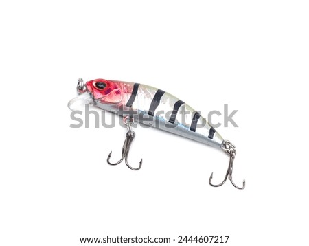 Picture of colorful fish shaped plug baits with 3 way hooks. Fishing equipment isolated on white background.