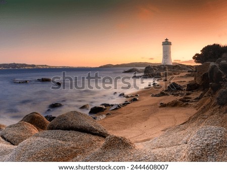 long exposure view of the Punta Palau Lighthouse on the Emerald Coast of Sardinia at sunrise Royalty-Free Stock Photo #2444608007