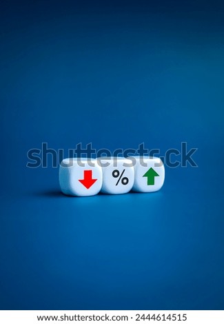 Percentage icon in middle of red down and green up arrows on white cube block on blue background, vertical style. Interest rate, financial stocks, ranking, GDP percent change, money exchange concepts.