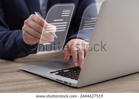 Woman signing electronic document at table, closeup. Virtual screen over laptop