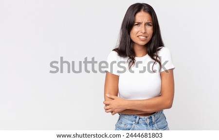 pretty thin hispanic woman feeling anxious, ill, sick and unhappy