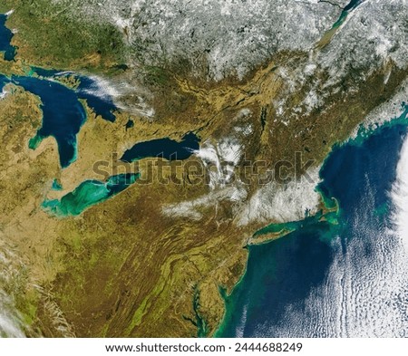 Snow across New England and Quebec. . Elements of this image furnished by NASA.