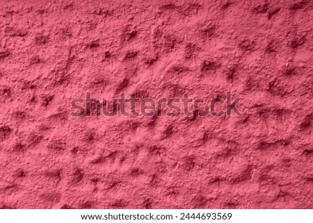 Abstract geometric concrete background with 3D structure with dots and fosse of the concrete in raspberry color with copy space