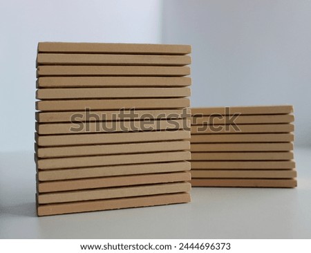 Two pallets of beige ceramic tiles isolated on white stock photo 
