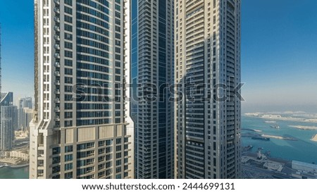 Scenic view of Dubai Marina Skyscrapers from top timelapse during all day with shadows moving very fast, United Arab Emirates Royalty-Free Stock Photo #2444699131