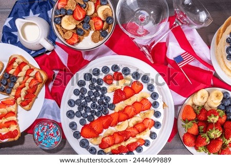 Fourth of July, Patriotic Independence day desserts.  4th of July sweet brunch food and snacks - toast sandwiches, flakes with berries, cake, pancakes, champagne with glasses, holiday decor, flags 