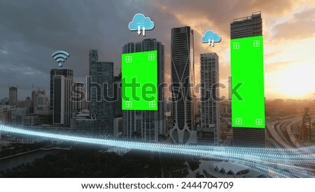 Modern smart city skyline with Empty billboard green screen and tracking markers, fast internet stream wifi and cloud concept logo. Aerial at sunset